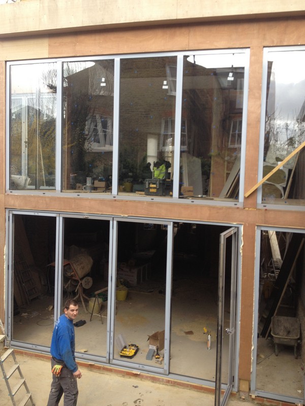 Aluminium bi-fold doors with two-storey glazing in Slough