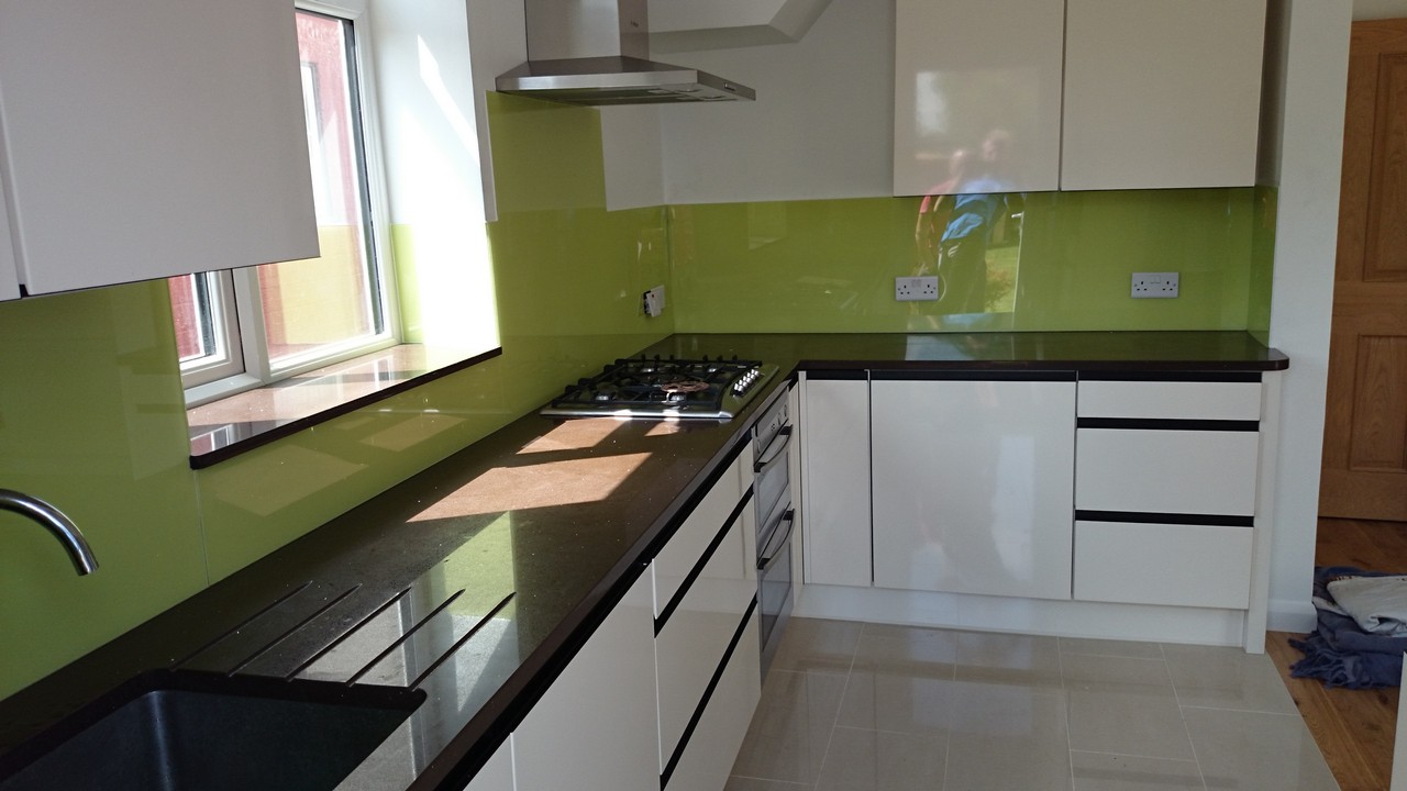 Lime green glass kitchen splashback installed by Slough glaziers