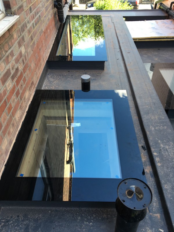Multiple flat roof skylights on extension in Slough