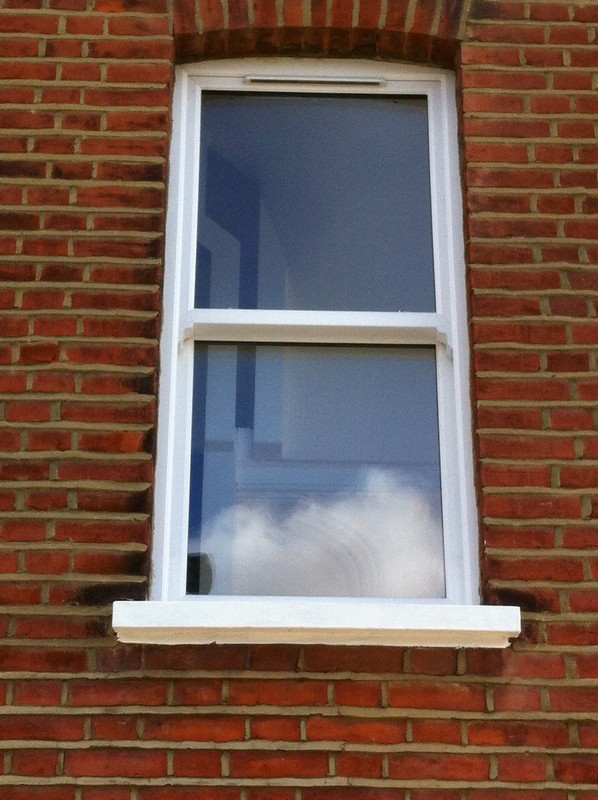 uPVC sash window on Victorian red brick house in Slough